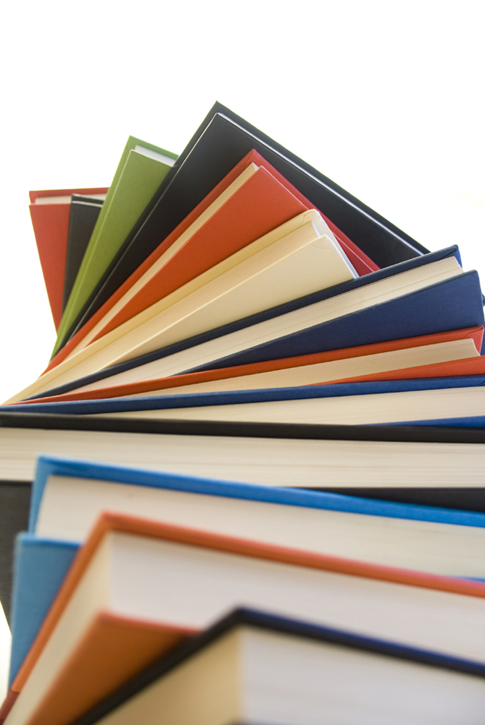 High pile of hardcover books